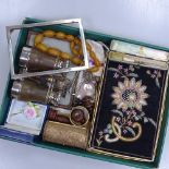 An embroidered bag, binoculars, a silver bookmark, a frame etc