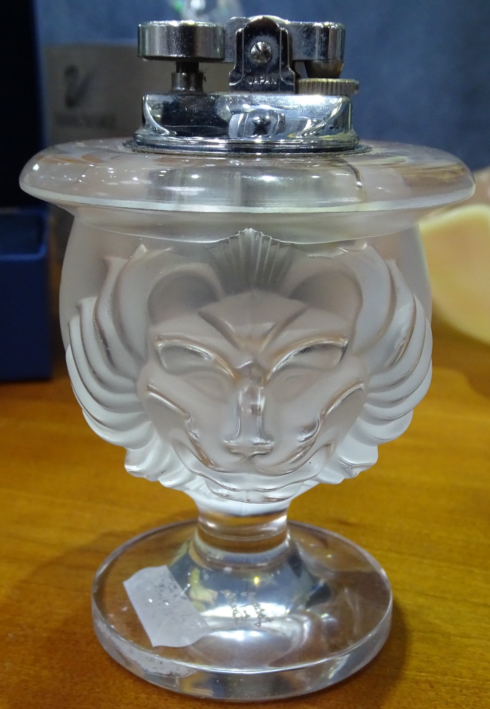 A moulded glass lion's head Vintage cigarette lighter, signed Lalique, height 11.5cm