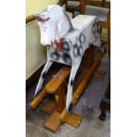 A small painted rocking horse on pine stand, H79cm, by Feeway