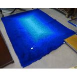 A 1960w Heal's rug of contrasting blue ground design, 230cm x 170cm