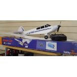 A boxed Super Cub model aeroplane, and another for spares