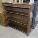 A Victorian carved oak open bookcase, W122cm, H115cm