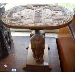 An African hardwood carved occasional table with elephant support, H35cm