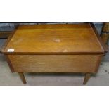 A teak sewing cabinet with fitted interior and contents
