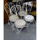 A set of 4 white painted wirework conservatory chairs