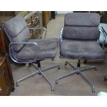 A pair of Charles Eames soft pad chairs in brown suede, by ICF, with maker's labels and swing tags