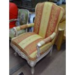 A Continental upholstered open-arm bedroom chair