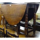 An Antique oak gateleg table on bobbin turned legs, W102cm
