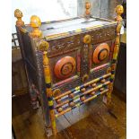 An Ethnic painted cabinet with rising top, and spindle turned decoration, W56cm, H74cm