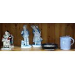 2 pairs of figures, a framed pot lid, and a Victorian mug
