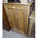 An Antique pine side cabinet with single panelled door