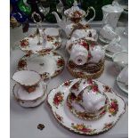 A Royal Albert Old Country Roses tea service, including teapot and cake stand