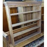 An Antique pine plate rack, W115cm, H109cm