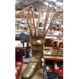 A Continental brass boot-design stick stand, horn-handled sticks etc