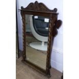 A Georgian style mahogany-framed wall mirror, and carved oak-framed wall mirror