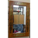 A wall mirror with inlaid brass decoration, height 58cm