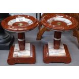 A pair of coloured marble candle stands, 18.5cm