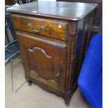 An Antique Continental oak side cabinet, with single frieze drawer and fielded panelled cupboard