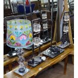 A pair of modern stylised chrome table lamps, and matching floor lamp.