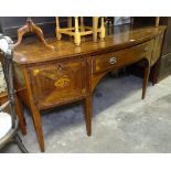 A George III mahogany bow-front sideboard, with drawers and cupboards and marquetry decoration,