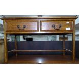 A low oak coffee table with 2 frieze drawers, W76cm, H46cm