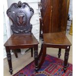 A pair of Victorian mahogany shield-back hall chairs, on turned legs