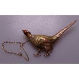 A 15ct 3-coloured gold and red enamel set figural pheasant brooch, 9g