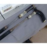 2 ebonised sword sticks with bone mounts