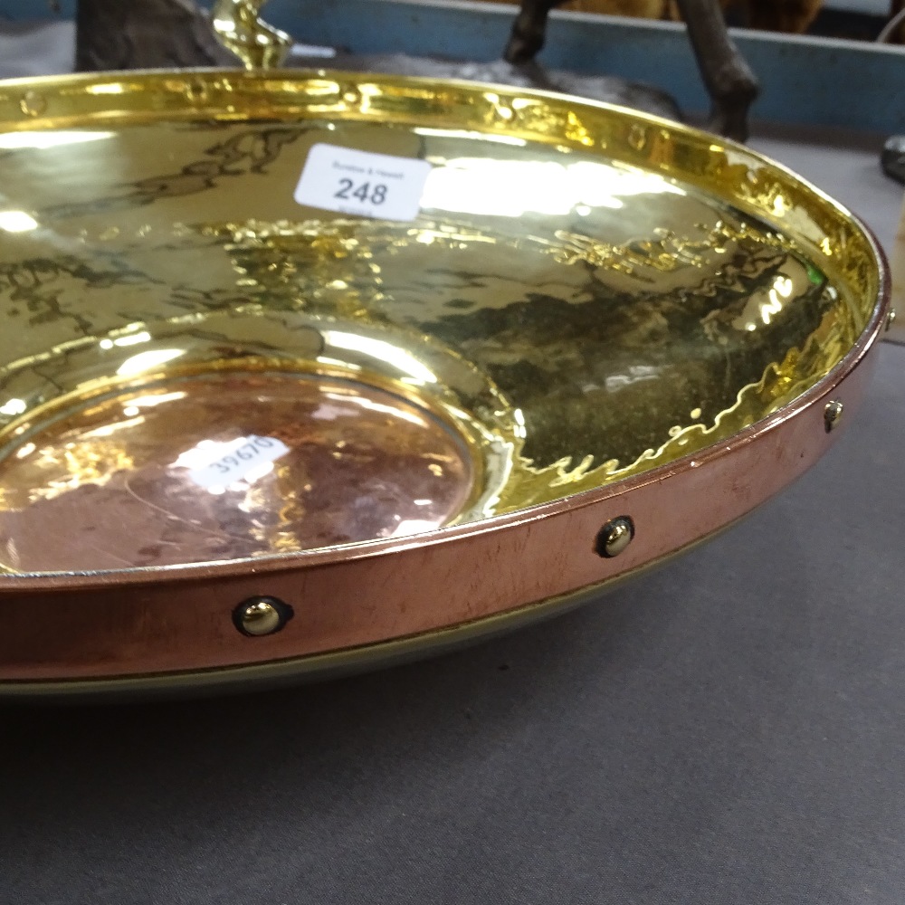 A copper and brass dish, and a pair of barley twist brass candlesticks, 25cm - Image 2 of 2