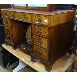 A reproduction mahogany twin-pedestal writing desk with fitted drawers, W120cm