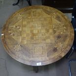 A 19th century Italian parquetry tilt-top table with games board design, on carved tripod base,