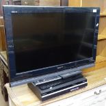 A Sony Bravia 32" flat screen television, with Sony DVD player, and remotes, GWO