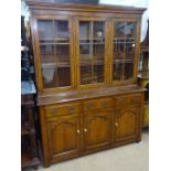 A good quality reproduction oak 2-section bookcase, having 3 lattice-glazed doors, with adjustable