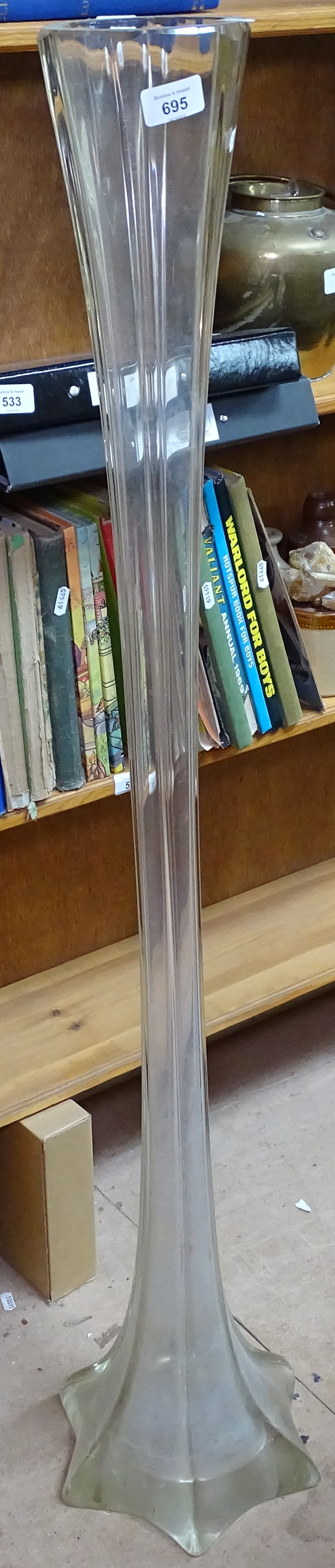 A tall moulded glass vase, 122cm