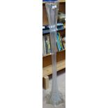 A tall moulded glass vase, 122cm