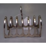 An Edwardian silver 6-section toast rack, Birmingham 1927