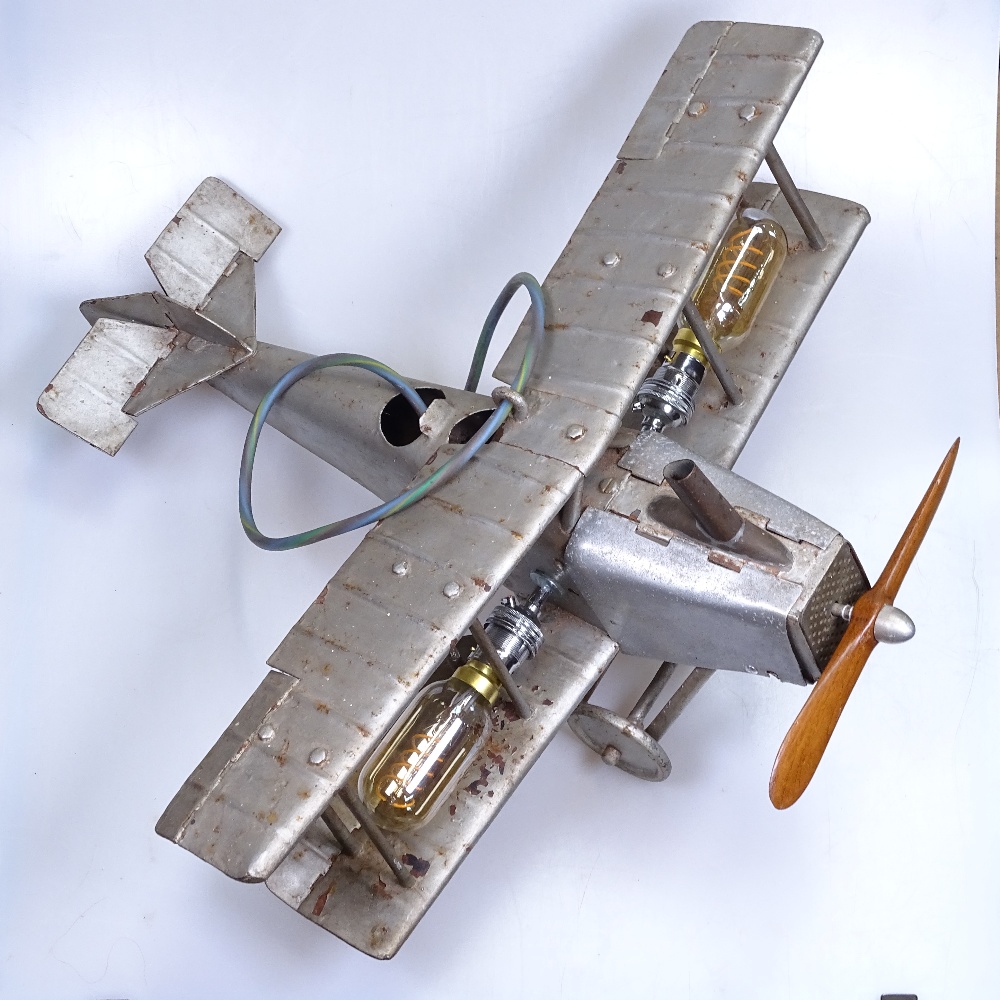 A tinplate bi-plane, length 50cm, converted to a table lamp - Image 2 of 2