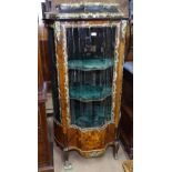 A Continental serpentine-front kingwood vitrine cabinet, having a marble top, single glazed door,