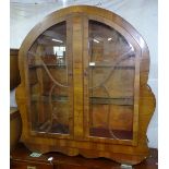 An Art Deco "Cloud design" walnut display cabinet, with 2 glazed doors, W122cm