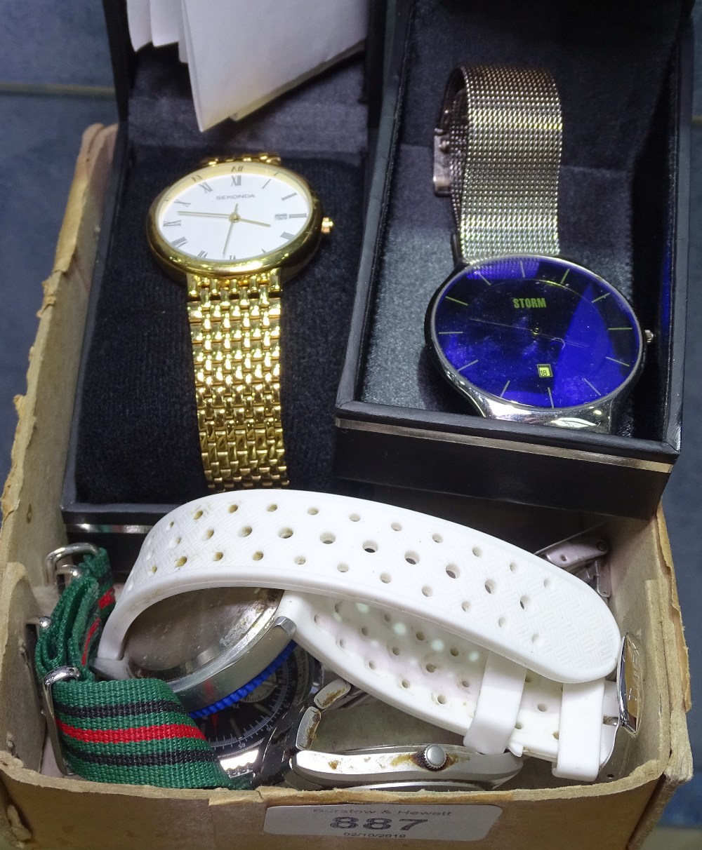 A collection of wristwatches, to include a Seiko, Storm, Timex, and a military style wristwatch