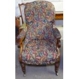 A 19th century mahogany-framed and upholstered open armchair