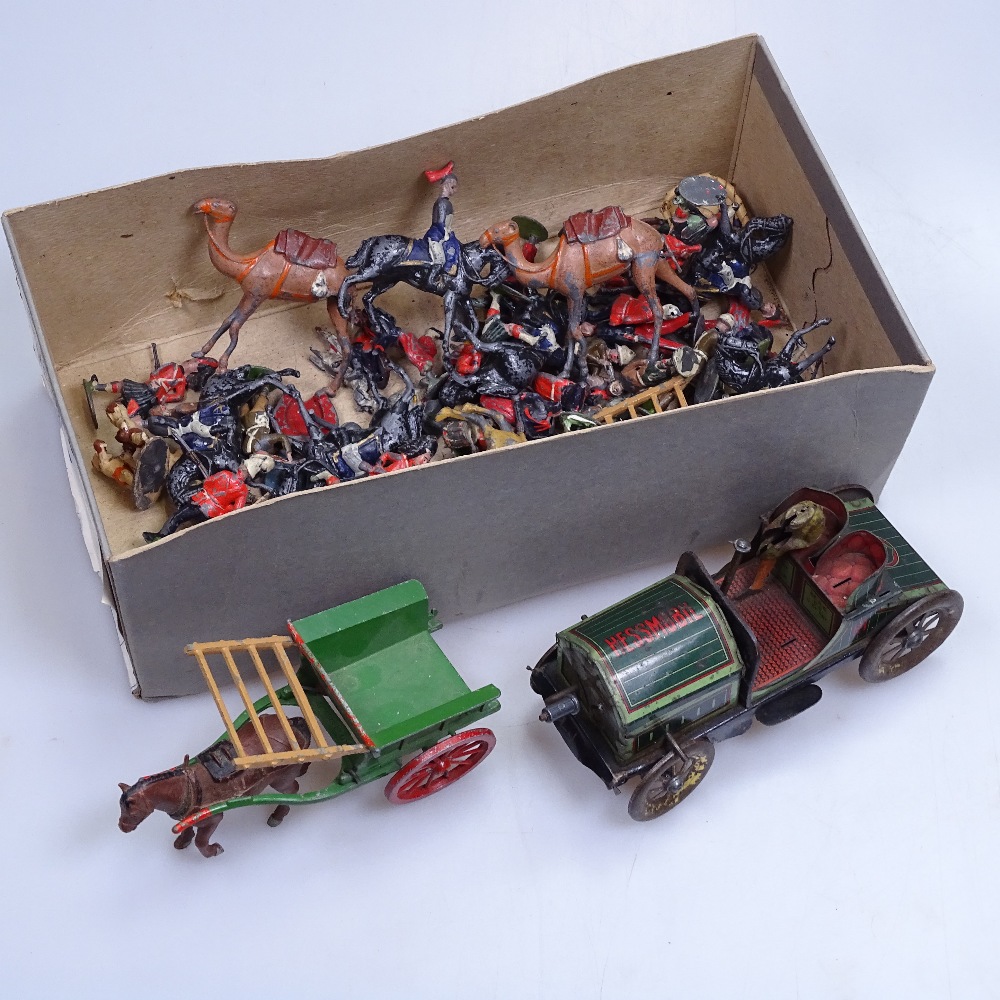 An Antique tinplate clockwork Veteran car, Britain's soldiers, and other diecast animals, cart etc