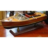 A model speedboat on stand, by Hanah, length 34cm