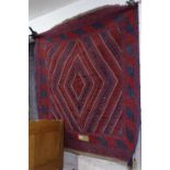 A red ground Beluchi rug, 126cm x 120cm