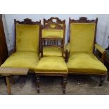 An Edwardian upholstered and walnut-framed armchair, with matching nursing chair, and 2 side chairs