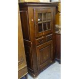 An Antique Continental oak cupboard, with glazed and panelled doors, W90cm, H154cm