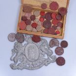 A box of Antique wax seals etc, and a metal coat of arms