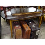 A mid-century Heal's teak extending dining table, raised on turned legs, with 2 spare leaves, length