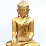 A 19th century Burmese carved and gold lacquered Buddha, 37cm