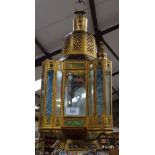 A Moroccan style gilt-metal lantern with coloured glass panels, height 45cm approx